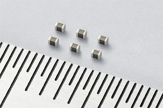 Photo: Kyocera's New 0201 MLCCs (Scale: 0.5mm)